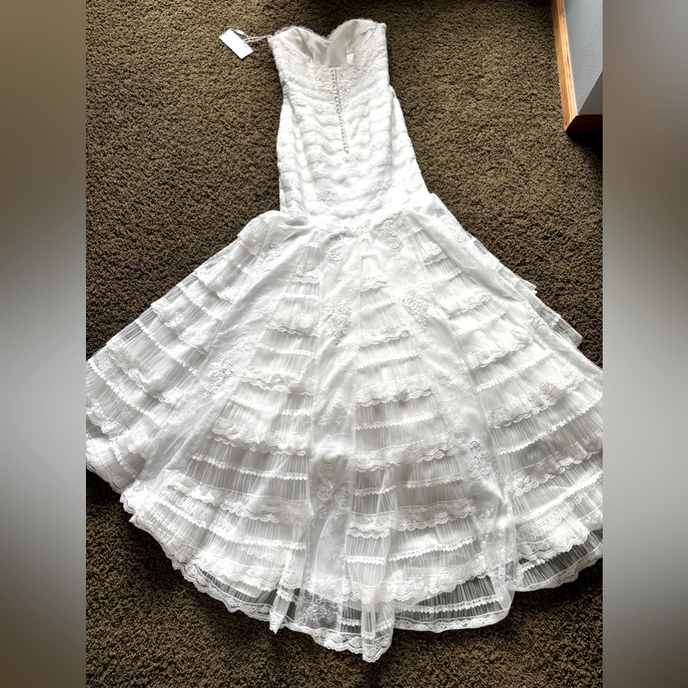 NWT designer wedding dress. Bought from “The White Dress” size 10 never altered - Picture 9 of 16